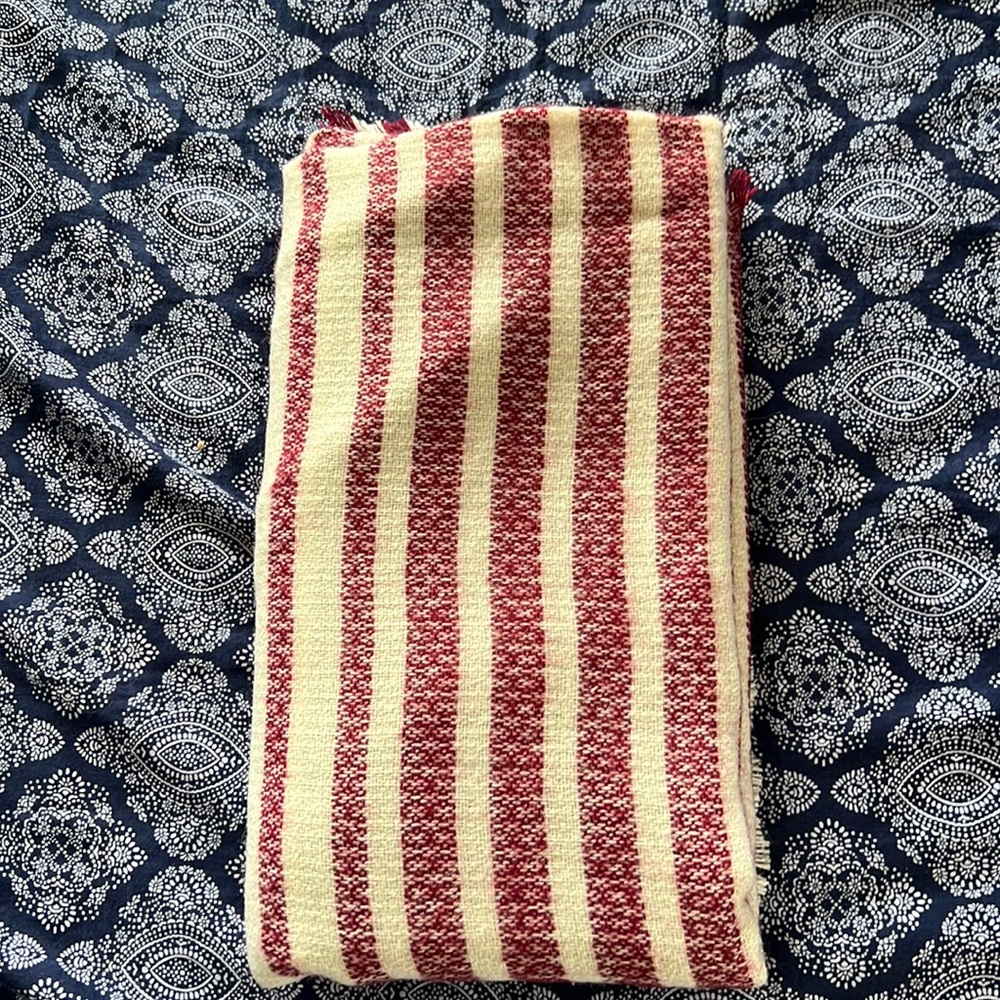Red and cream colored large scarf shawl.
